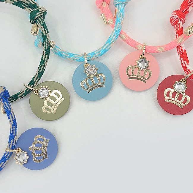A group of bracelets with crowns on them.