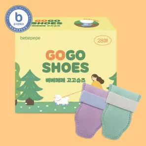 A box of shoes with two pairs of socks on top