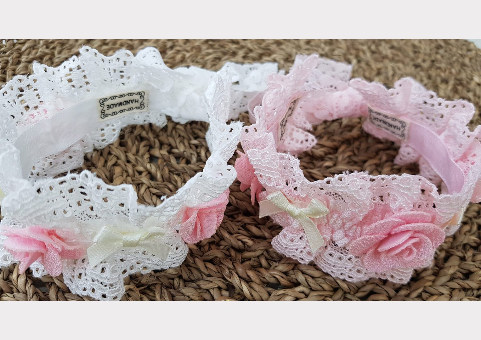 Two bracelets with lace and flowers on them.
